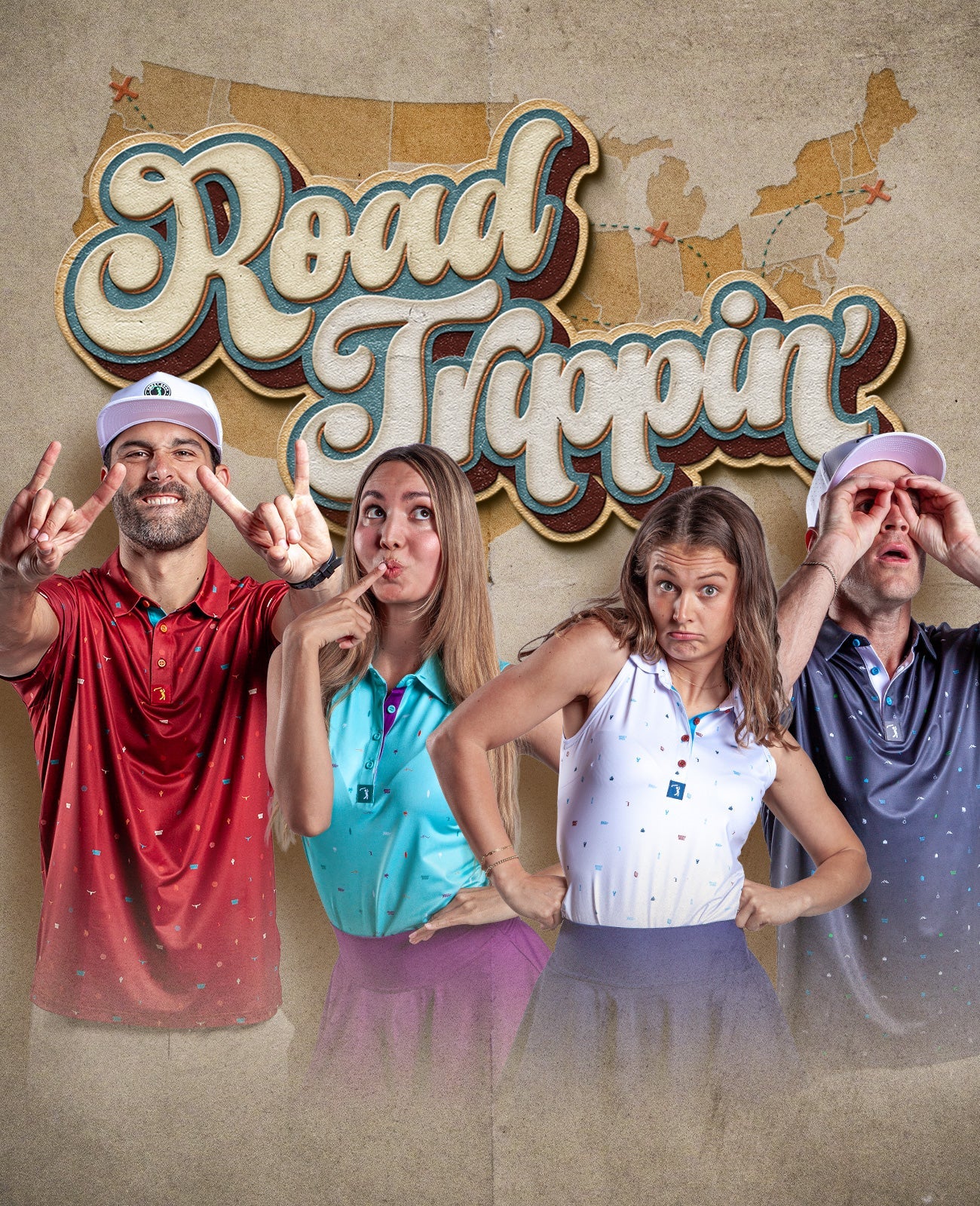 Four people in colorful polos pose playfully before a vintage-style Road Trippin sign with a U.S. map background; two women and two men make funny faces and hand gestures.