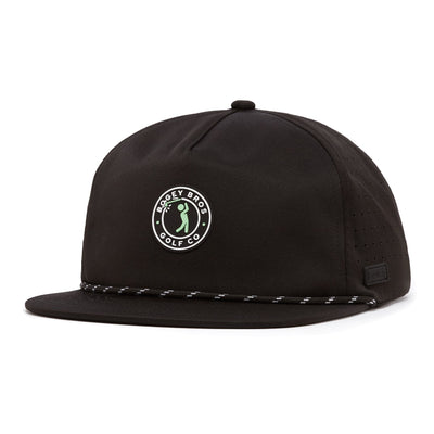 The Bogeyman Stamp Black Unstructured Flat Bill Hat is a black snapback featuring a circular Bogey Bros Golf Co. logo with a green cartoon golfer, black and white rope across the brim, and side ventilation holes.