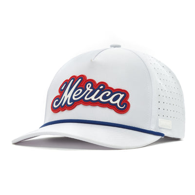 The 'Merica - Performance Golf Hat - Snapback is a white cap made of performance material with side perforations, blue bill trim, bold cursive "Merica" in blue with red outline, and a structured snapback design with a top button.