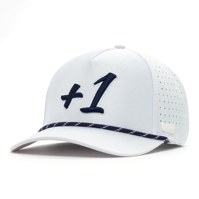 The +1 - Performance Golf Rope Hat - Snapback is a white cap with bold navy "+1" text, navy patterned band above the brim, sweat stain resistant performance fabric, side perforations for ventilation, and an adjustable snapback.