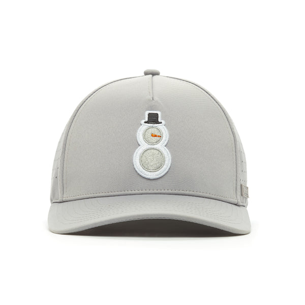 The Snowman - Performance Golf Hat - Snapback is a light gray cap with a white embroidered snowman, black hat, orange carrot nose, and stick arms. It features a curved brim, smooth texture, and sweat stain resistance for lasting freshness.