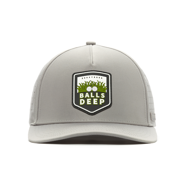 The Balls Deep - Performance Golf Hat - Snapback is a light gray front-view cap featuring a patch with golf balls, grass, and "Balls Deep" in bold white letters on a black and green shield. It has visible panel stitching and a flat brim.