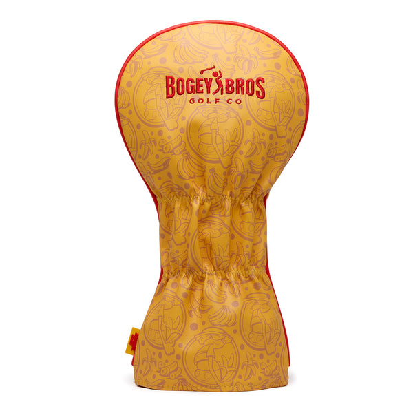 Introducing the Johnny Chimpo - Driver Headcover: a premium yellow PU leather driver cover featuring playful cartoon embroidery, bold red “Bogey Bros Golf Co” text, and eye-catching red edging. This stylish headcover is cinched at the middle for a secure fit and stands upright against a white background. Durable with its woven label design, it’s the perfect accessory for any golfer looking to add character and protection to their gear.