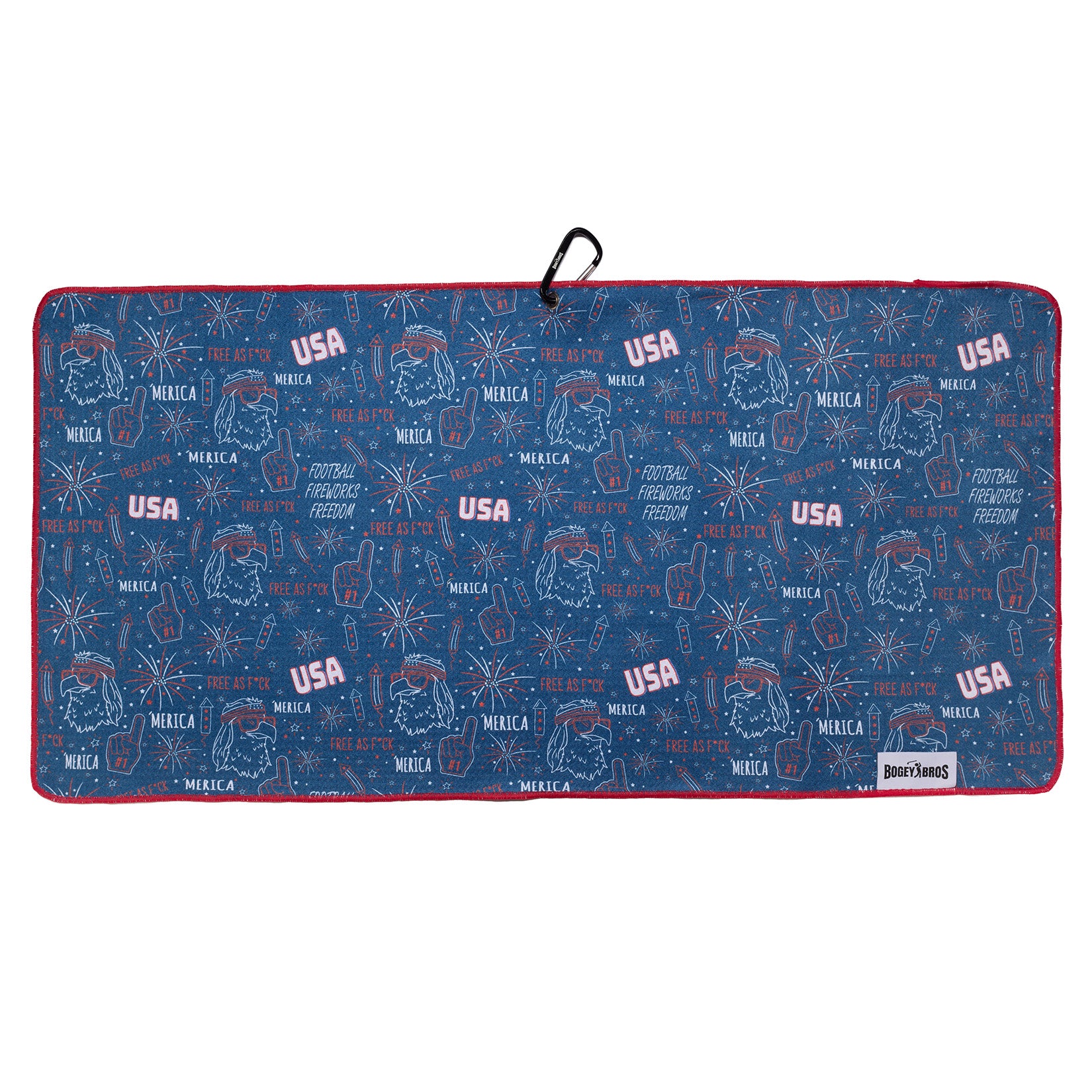 Rectangular blue towel with red trim, featuring white and red sketches of USA flags, football helmets, foam fingers, fireworks, and phrases like “USA,” “Football, Family, Freedom,” and “’MERICA.” There’s a black hanging loop at the top center.