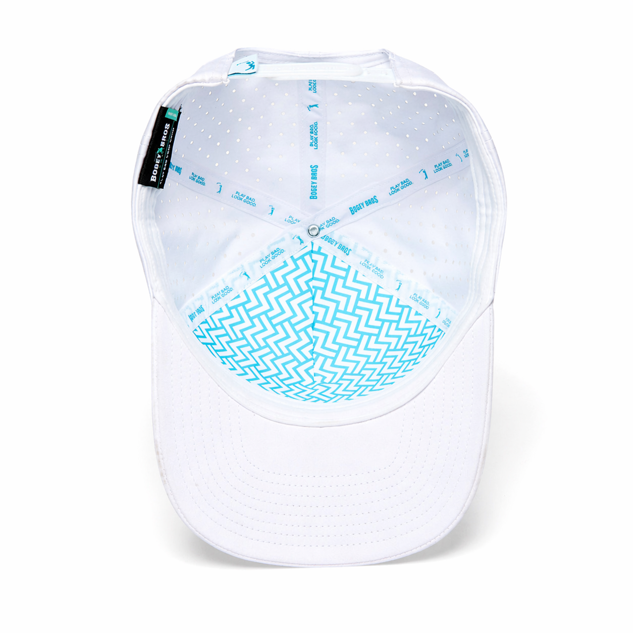 Top-down view of the Bogeyman - White/Teal Performance Golf Hat Snapback showing the white, sweat stain-resistant sweatband with blue zigzag patterns, “BUCKETS” branding, ventilation holes, and a black woven label stitched inside.