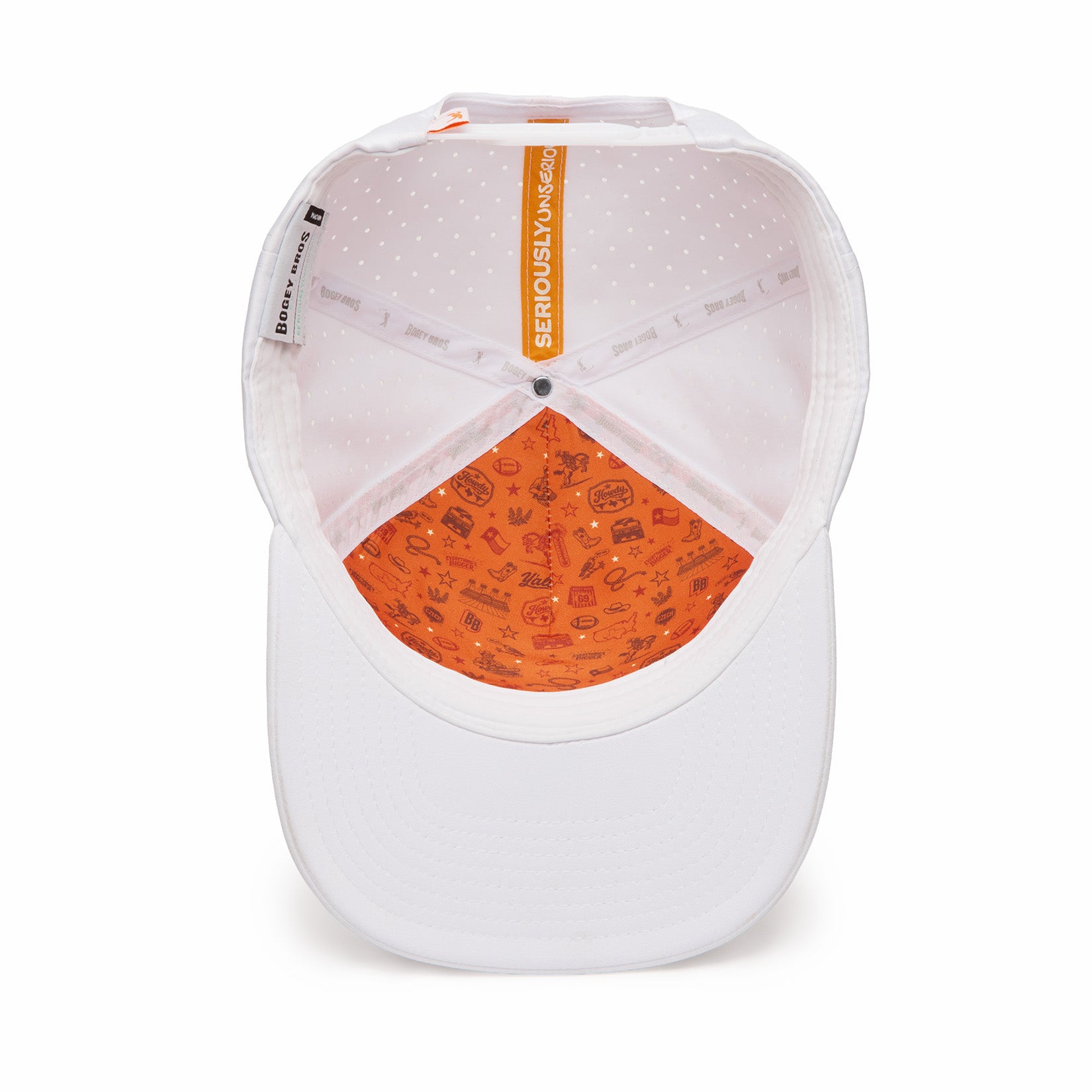 The image shows the inside of a white baseball cap. The inner crown is light pink with white dots, and the sweatband is orange with small playful doodles. The label inside reads SERIOUSLY FUN. The brim is plain white.