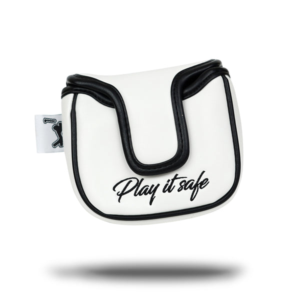 The PULL OUT - Mallet Putter Headcover features white and black premium PU leather, "Play it safe" in black script, a curved flap, magnetic clasp, and a golfer silhouette tag. Its design gives the illusion of floating above its shadow.