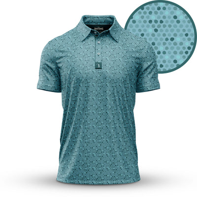 The Dots - Teal - Polo features an athletic fit in light blue with a subtle pattern of small overlapping black and dark blue dots, UPF 50 protection, a collar, and three buttons. Shown on a white background with a close-up of the dot design.