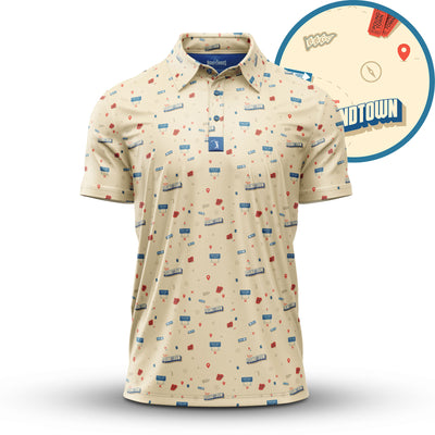 The Poundtown - Polo is a beige, athletic-fit short-sleeve polo featuring a scattered print of blue GPT tags, red map pins, blue thumbs-up icons, and street name labels. A close-up inset shows extra details like a stamp and "GPTTOWN".