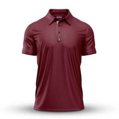 The Solid Oxblood - Polo, an athletic-fit short-sleeve shirt in maroon, is shown on a white background. It features a classic collar, three-button placket, and subtle fabric folds. The shirt has no visible logos or designs.