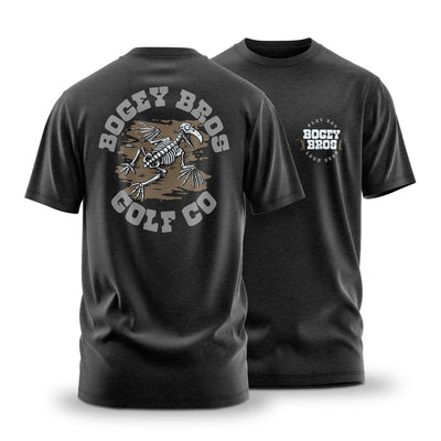 The Dead On Arrival - T-Shirt is a black jersey tee with a small "Bogey Bros Golf Co." logo on the chest and a bold bird skeleton swinging a golf club graphic on the back, made from stretchy, comfortable fabric with an athletic fit.