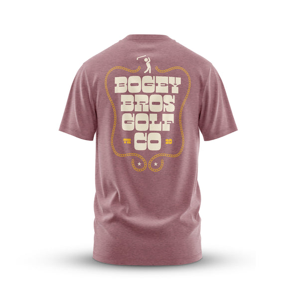 The Outlawed - T-Shirt is shown from the back in mauve, with bold cream "BOGEY BROS GOLF CO" text inside a yellow rope border and two small stars at the bottom.