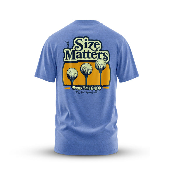 The Size Matters - T-Shirt is an athletic fit blue tee with a back graphic of three golf balls on tees in front of a yellow sunset, bold "Size Matters" text, and "Bogey Bros Golf - Play bad, look good" underneath. Tagless jersey for comfort.