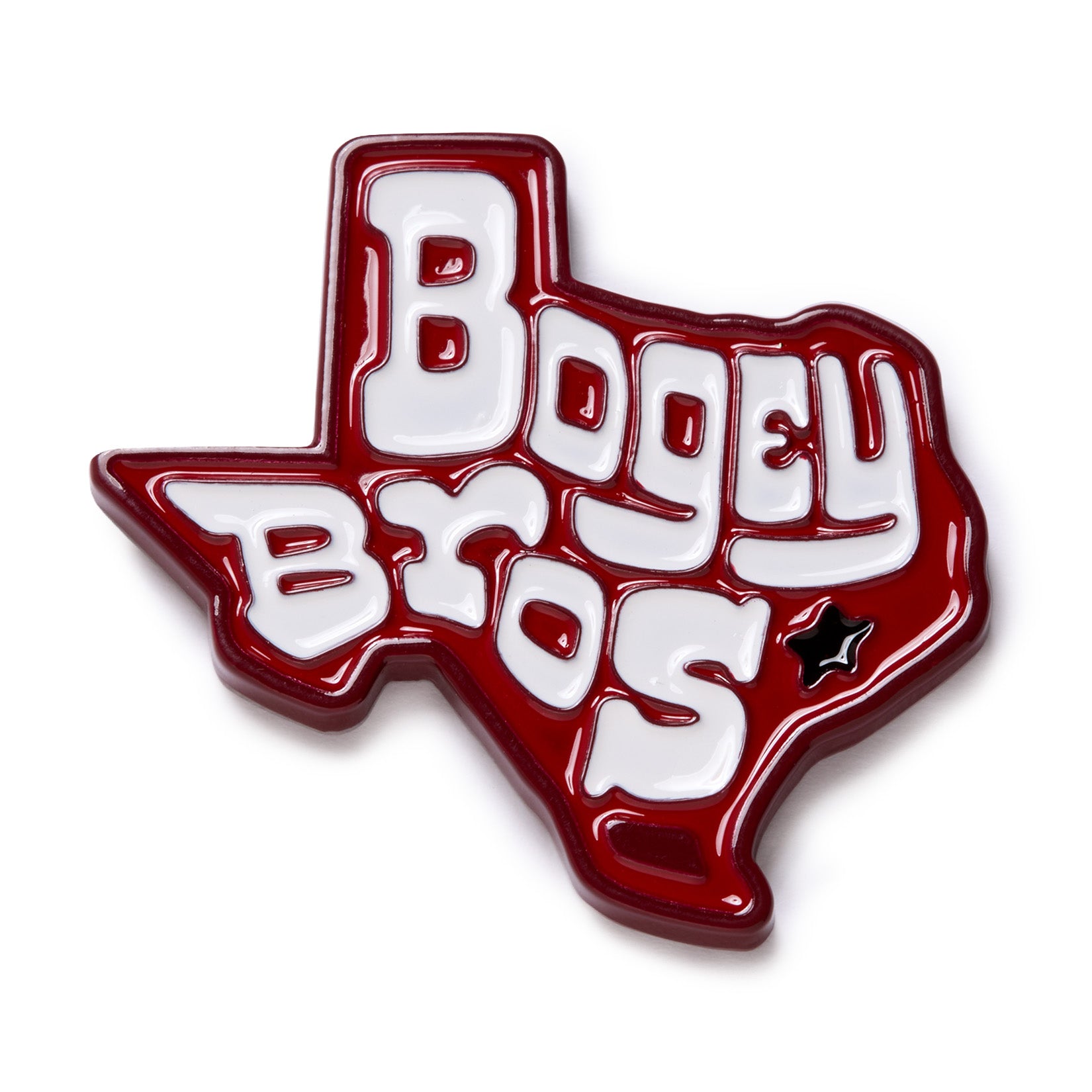 Red enamel pin shaped like Texas with “Bogey Bros” in bold, white, stylized letters. A small black star with a white outline is near the lower right of the pin, marking a location on the Texas outline. The design has a glossy finish.