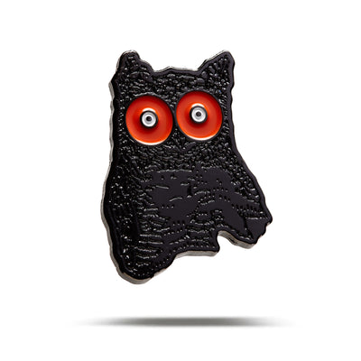 The Night Owl - Ball Marker is a black, textured pin with a stylized, wavy cat design featuring large red and silver eyes, iron nickel plating, and shown on a white background with a subtle shadow.
