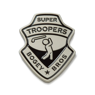 A metallic badge-shaped pin with iron nickel plating features the words SUPER TROOPERS at the top, a golfer swinging a club in the center, and BOGEY BROS at the bottom with a star between the words. The design is raised, uses black and silver coloring, and can be paired with a magnetic clip or heavy metal ball marker for added convenience on the course.