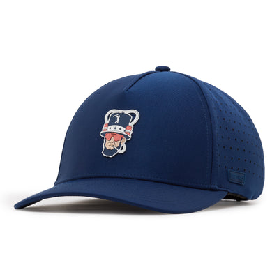 A blue baseball cap with a curved brim and perforated side panels. The front features a patch of a cartoon baseball player with a mustache, red sunglasses, and a navy cap. The cap has a structured crown and a small top button.