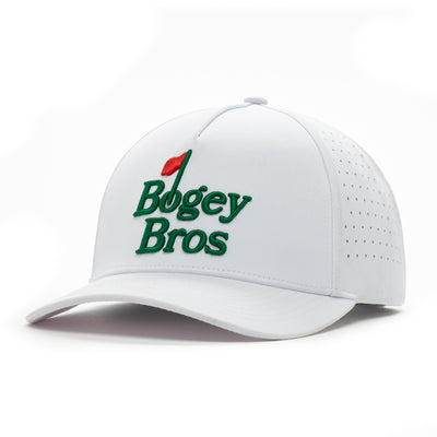 The Bogey Bros White Performance Golf Hat is a snapback featuring “Bogey Bros” embroidered in green, with the “l” as a red golf flagstick. Made from sweat stain resistant fabric with side ventilation holes.