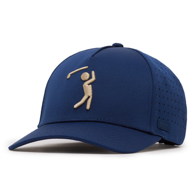 The Bogeyman Navy/Tan Performance Golf Hat is a blue snapback cap with a beige embroidered golfer on the front, curved brim, perforated sides and back, sweat stain resistance, and a small tag on the left side of the brim.