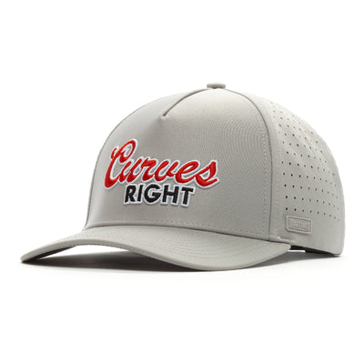The Curves Right Performance Golf Hat is a light gray snapback with a curved bill, made from performance material. "Curves RIGHT" appears in red and white embroidery on the front, plus side vents and a small tag near the brim.