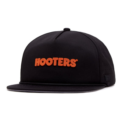 The Hooters - Unstructured Flat Bill Hat - Snapback is a black flat brim cap with bold orange 3D HOOTERS letters, a structured crown, stitched brim, top button, and a subtle black logo tag on the left side near the brim.