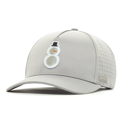 The Snowman Performance Golf Hat is a light gray snapback with a curved brim, perforated side panels, and sweat stain resistant fabric. An embroidered snowman decorates the front; a metallic stitched label accents the side.