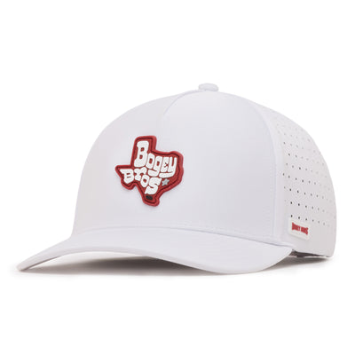 A white baseball cap with a red patch in the shape of Texas and the words Bogey Bros on the front. The side of the cap features small ventilation holes and a small red label. The cap is viewed from a front left angle.