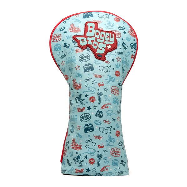 Introducing the Everything’s Bigger - Driver Headcover: a light blue cover edged with bold red trim and adorned with Bogey Bros lettering in crisp white and vibrant red. Made from high-quality PU leather, this driver headcover boasts a lively, all-over pattern of embroidered golf-themed doodles—including clubs, balls, trophies, maps, and the word “Yall”—all rendered in red and blue for a fun and playful design.