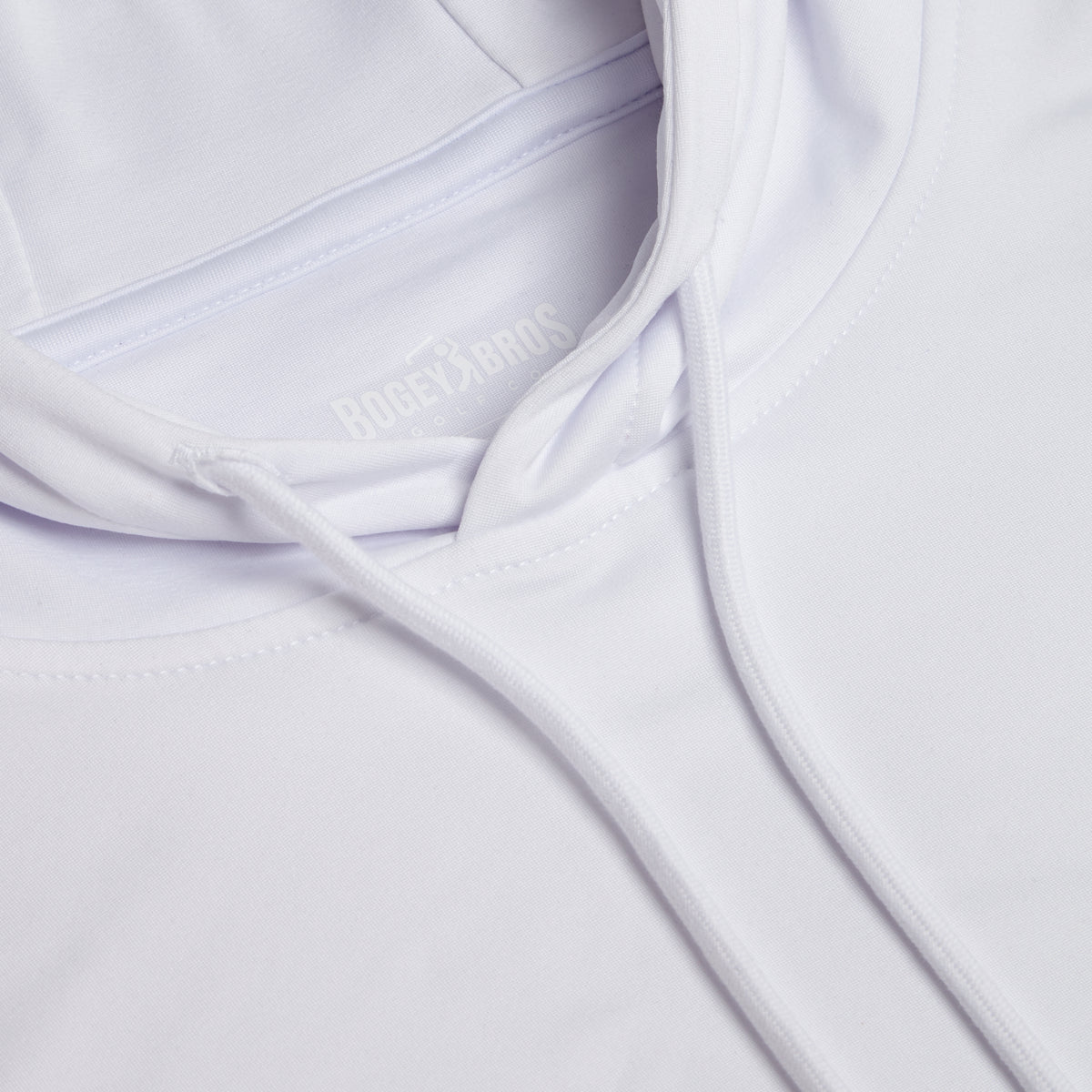 Close-up of the White - Hoodie, highlighting the hood, drawstrings, and part of the collar. The fabric features a smooth texture with moisture-wicking properties, and the BOGEY BROS label is subtly visible inside the neckline. The image showcases the garment’s clean, minimalist design and athletic fit.
