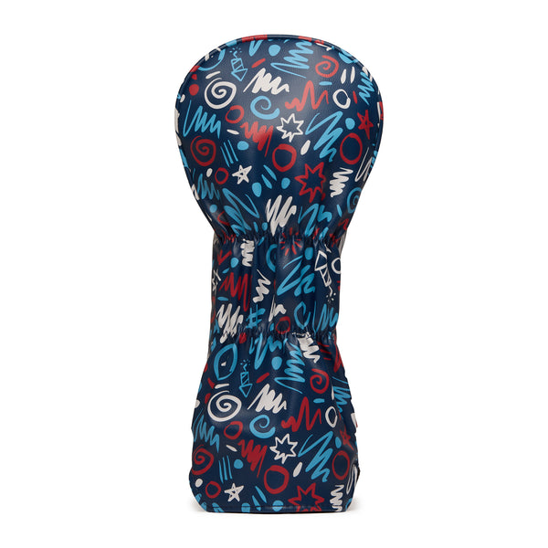 A golf club headcover with a playful, abstract pattern in blue, white, and red. The design features scribbles, zigzags, spirals, and stars on a dark background, giving it a fun and modern look. The cover is shaped to fit over a golf club head.