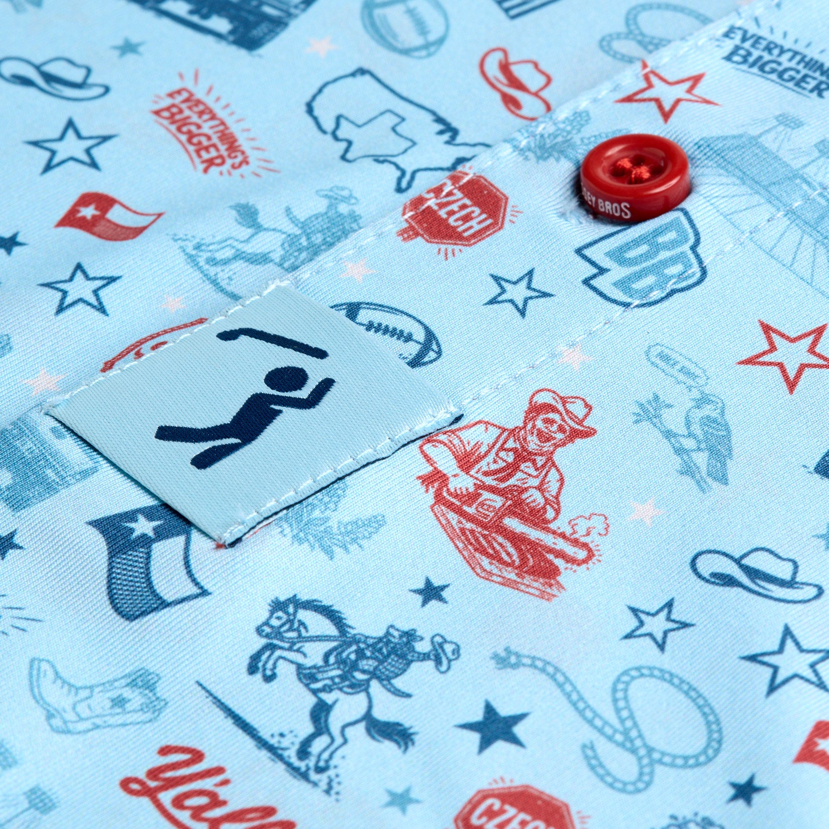 Close-up of blue fabric with Texas-themed doodles: cowboy, hat, state outline, rodeo, football, boots, stars, Texas flag, barbecue, and slogans. Red button and a small tab with a stick figure present. Designs are in red, navy, and light blue.