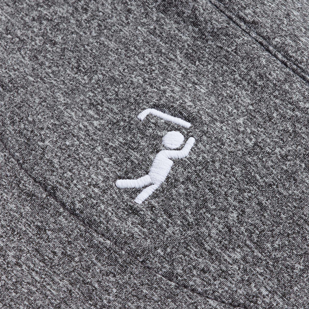 A white embroidered stick-figure golfer swings a club on the Heather Gray - Q-Zip, with the textured heather gray fabric and raised golfer design clearly visible. Featuring an athletic fit and moisture-wicking properties, this piece keeps you comfortable while the crisp stitching stands out against the darker material.