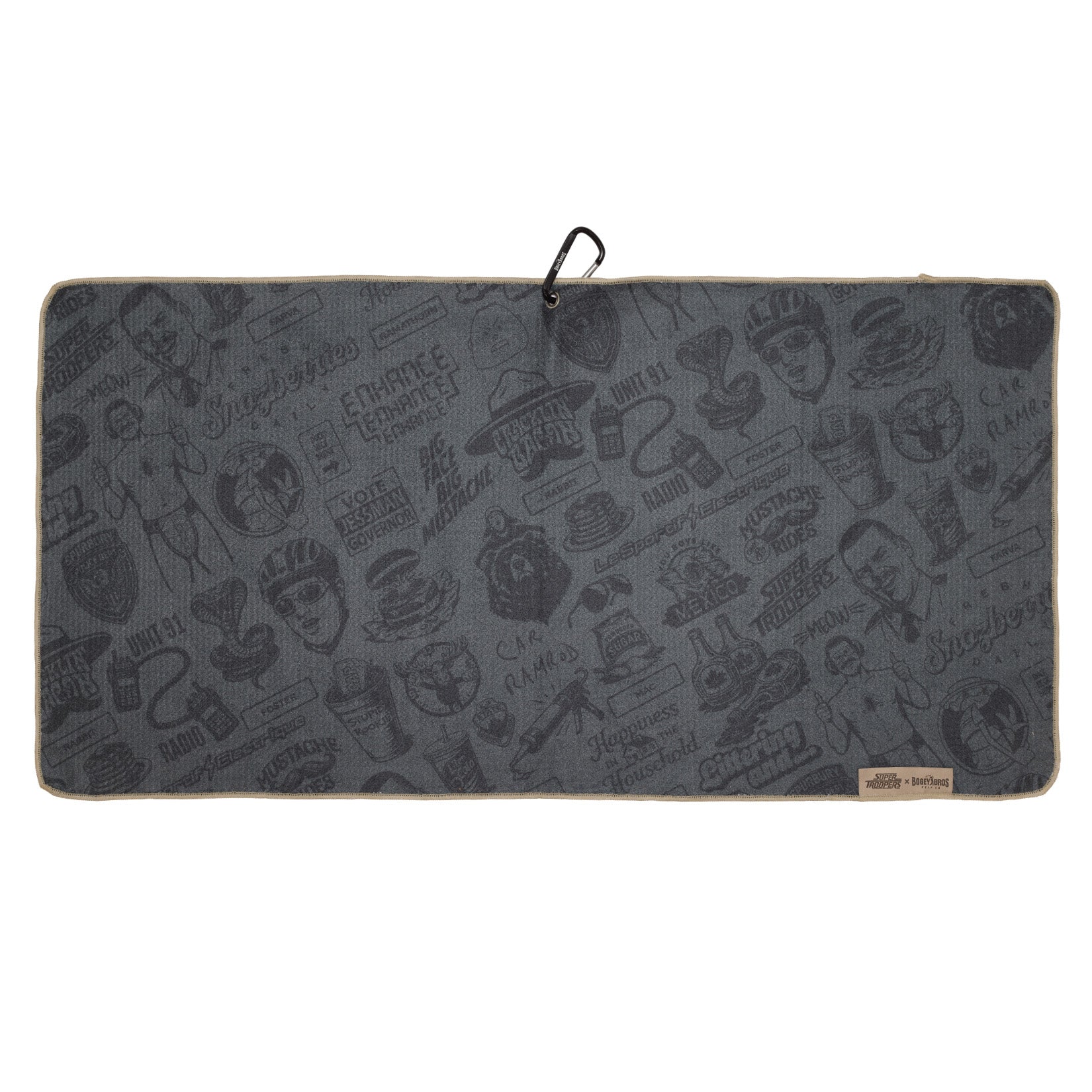 A rectangular, dark gray towel with various black, vintage-style illustrations and text, including food items, faces, and logos. It has a light beige border and a looped black string for hanging, along with a small tan label at the bottom edge.