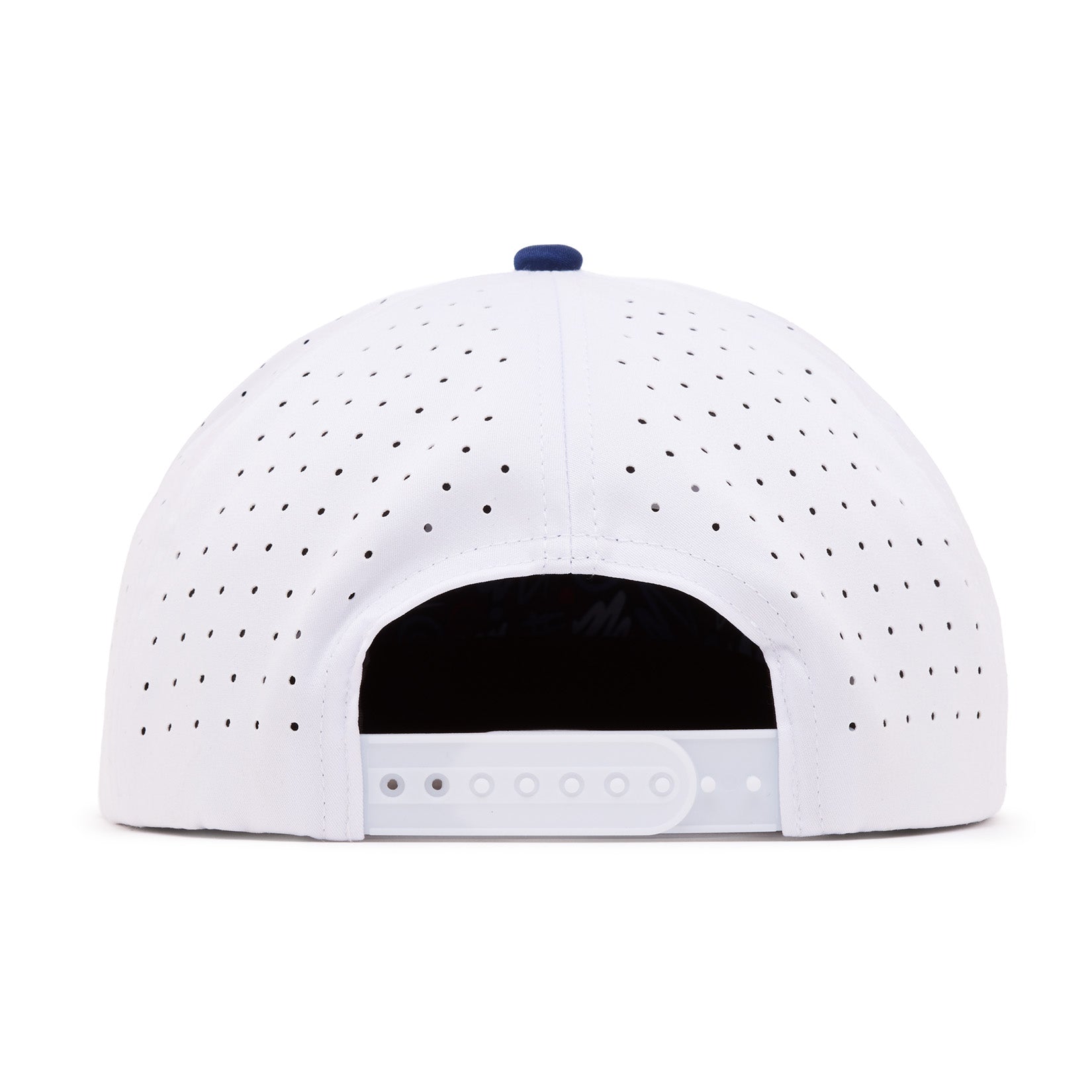The image shows the back view of a white baseball cap with small ventilation holes. The cap features an adjustable plastic snapback strap, and a small blue button is visible at the top center. The inside of the cap appears dark.