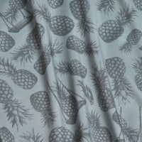 The Aloha Exchange - Polo features gray fabric with a sketched pineapple pattern in various directions. Visible folds add depth, while its athletic fit and moisture-wicking properties ensure all-day comfort.