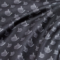 Close-up of the Birdie Finger - Raven - Polo's black, subtly shiny fabric, featuring a repeating light gray middle finger hand icon pattern and a smooth, slightly ribbed texture with moisture-wicking comfort.