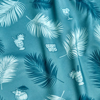 The Boat Drinks - Polo features a teal fabric with tropical palm leaves, colorful cocktails (some with umbrellas or fruit), and playful white 
