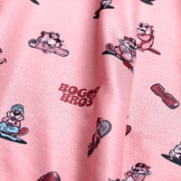 Close-up of the Dam Beavers - Polo's pink fabric, showcasing cheerful cartoon beavers in hats, some with logs, and red LOGOS BROS text at the center. Athletic fit with visible texture, playful folds, and fun details throughout.