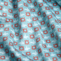 A close-up of the Finger Bang - Polo fabric shows a light blue background with repeating red star patterns and subtle white animal silhouettes, possibly llamas or alpacas. This textured, slightly wrinkled material provides UPF 50 sun protection.