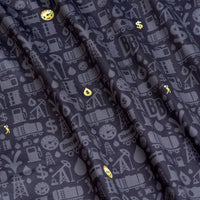 The Gusher - Polo features dark, folded fabric with gray oil rigs and barrels, scattered yellow emojis, an athletic fit, and moisture-wicking properties for all-day comfort.