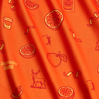 The Main Squeeze - Polo features orange fabric with red illustrations of oranges, slices, peaches, deer, shot glasses, a Jägermeister Orange bottle, cocktail twists, and a small golfer in a playful repeat pattern—plus an athletic fit for comfort and style.