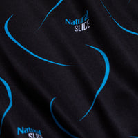 Close-up of the Natural Slice - Polo: black fabric with light blue curved lines and “Natural SLICE” printed in blue/white. The subtly textured material offers moisture wicking for comfort during any activity.