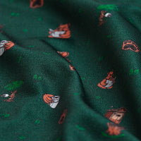 Nature Calls - Polo: Dark green fabric with a playful pattern of small orange foxes in various poses, featuring scattered fox faces and green grass. Enjoy UPF 50 protection while staying stylish and comfortable.