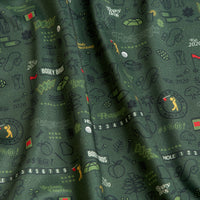 A close-up of the Peasants '26 - Polo: dark green fabric with golf balls, flags, clubs, scorecards, and “Bogey Bros” text in yellow, green, black, and red; crafted for an athletic fit with UPF 50 protection and a soft drape.