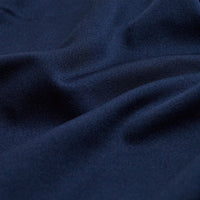 Close-up of Solid Navy - Polo fabric: dark navy blue with a subtle textured weave. The material is soft, smooth, and features advanced moisture wicking for lasting comfort.