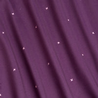 A close-up of the Exes - Plum - Polo shows deep purple fabric with thin vertical lines and pink embroidered X and plus shapes. Soft, wavy folds add texture and depth to this minimalist, moisture-wicking polo shirt.