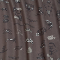 Brown fabric with black outlined illustrations including a football helmet, a muscled man, a radio, sunglasses, a snake, a raccoon, text phrases like Meow, Littering and…, Super Troopers, and other doodles from the movie Super Troopers..