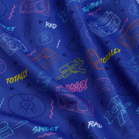 Radical - Women's Polo features blue fabric with colorful neon doodles of cassette tapes, boomboxes, camcorders, vinyl records, and playful words. The retro 80s/90s look meets athletic fit and moisture-wicking for all-day comfort.