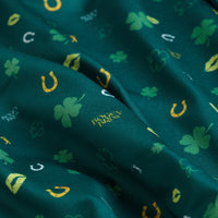 Gettin' Lucky - Women's Polo features green fabric with yellow horseshoes, clovers, top hats, and 