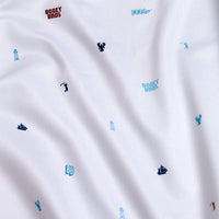 The Port - Women's Polo features white, moisture-wicking fabric with blue and navy icons—lobster, boat, anchor, lighthouse, golf tee—plus red “BOGEY BROS” text. It offers a soft feel and smooth texture for all-day comfort.